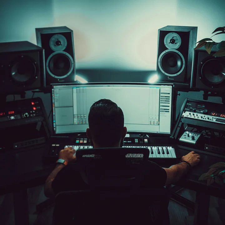 Producer working at a recording studio desk